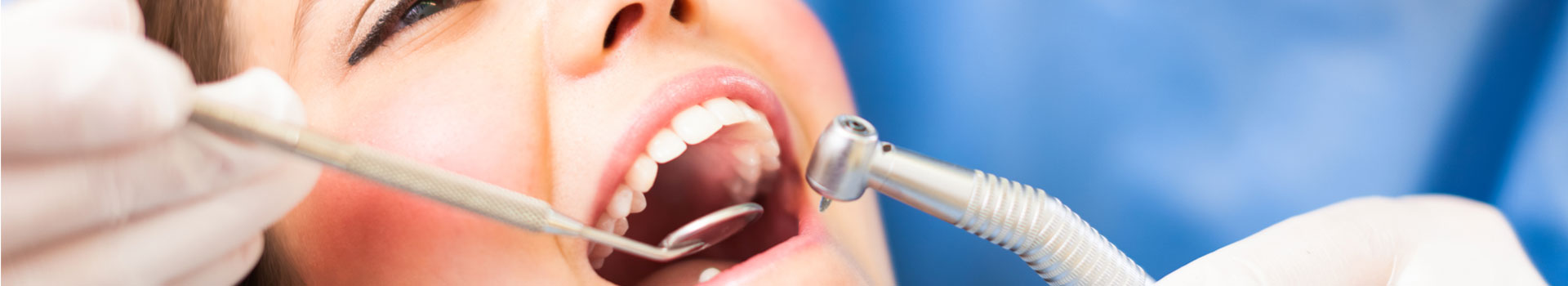 Dentist examining patient teeth
